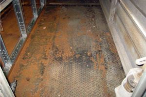 Intake chamber floor with corroded diamond plate at a university in Cambridge, MA