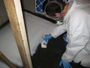 AQUIS technician applying advanced fire barrier on engineered epoxy for NFPA 90A compliance