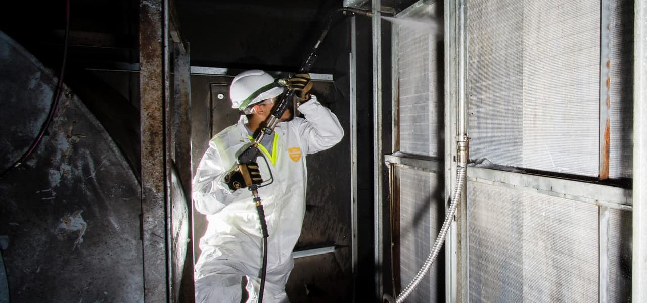 Coil cleaning and coil restoration for industrial air handling unit